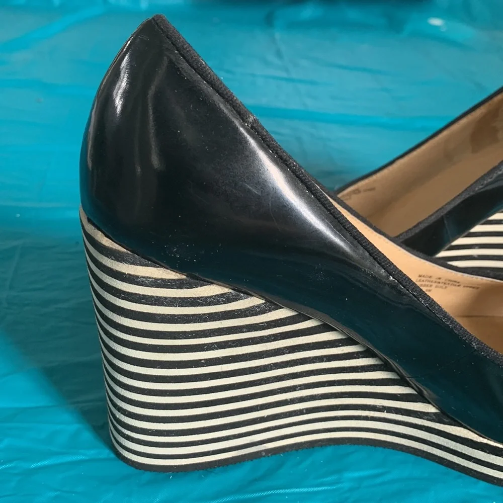 Gently worn Michael Kors Adlai’s Black and Cream Strip Wedge Shoes.